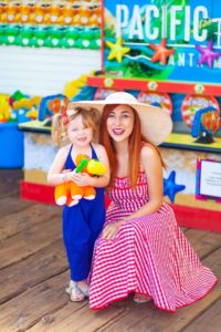 Woman and daughter with game prize