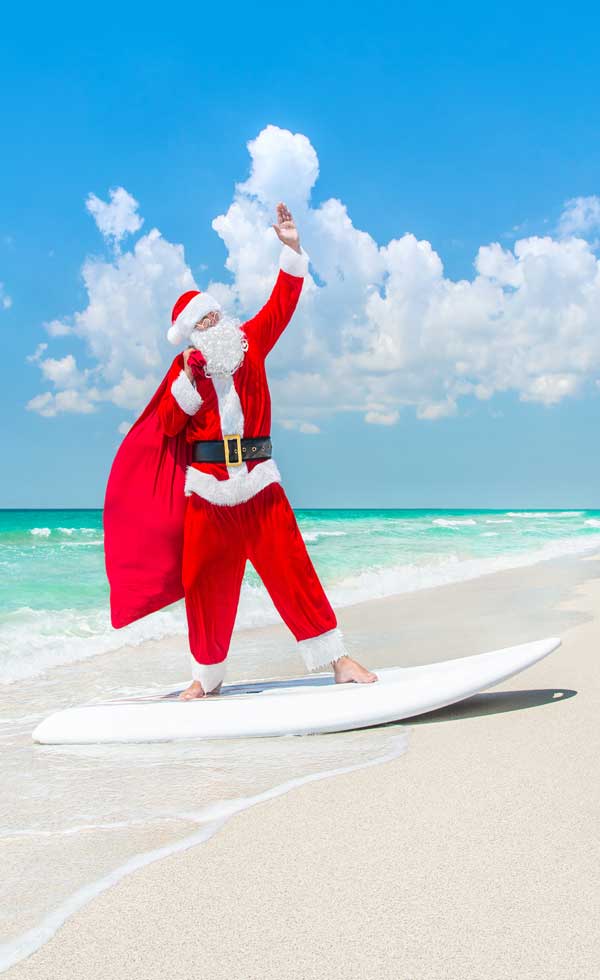 Surfer Santa on the beach