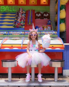 Girl with cotton candy inside Pacific Park