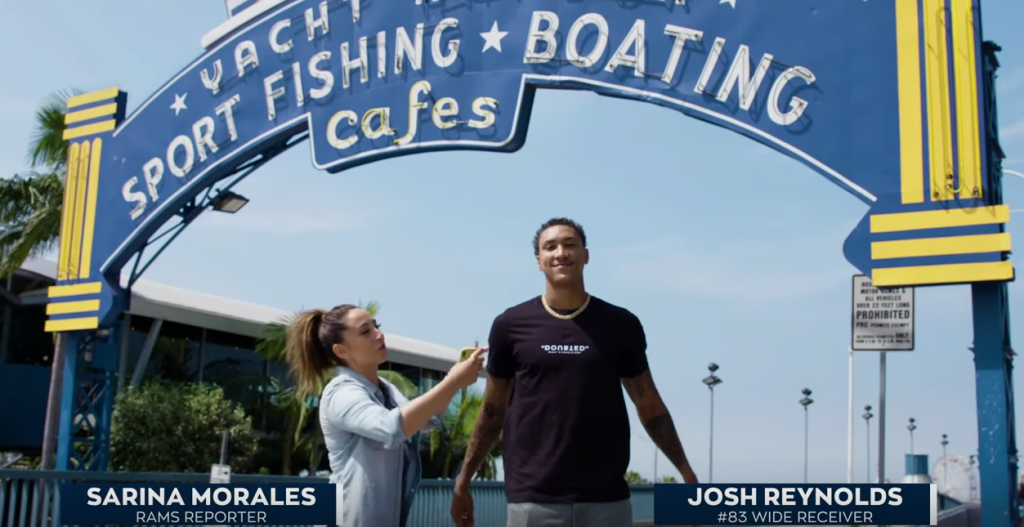 Josh Reynolds in front of Santa Monica Pier sign