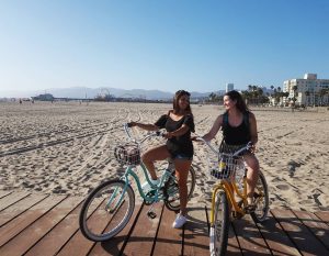 Two women with bikes on the Santa Monica boardwalk