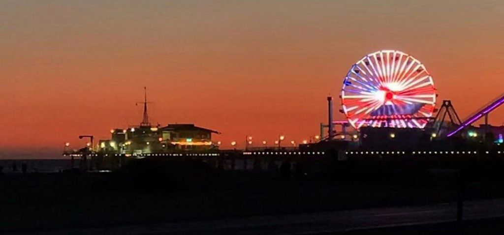 The American flag displayed on the Santa Monica Pier Ferris Wheel - photo by @twocrazytraveldudes