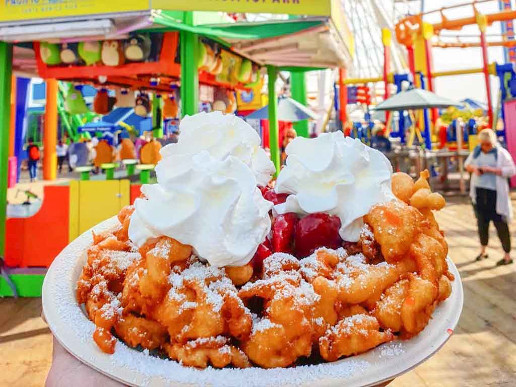 Funnel Cake in front of the Santa Monica Pier Ferris wheel