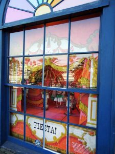 Window with marionettes on display