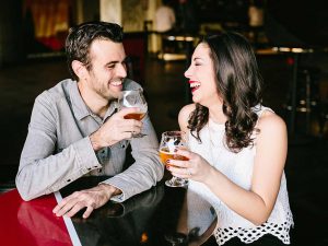 Couple holding beer