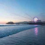 Santa Monica Pier as seen from the beach at dusk