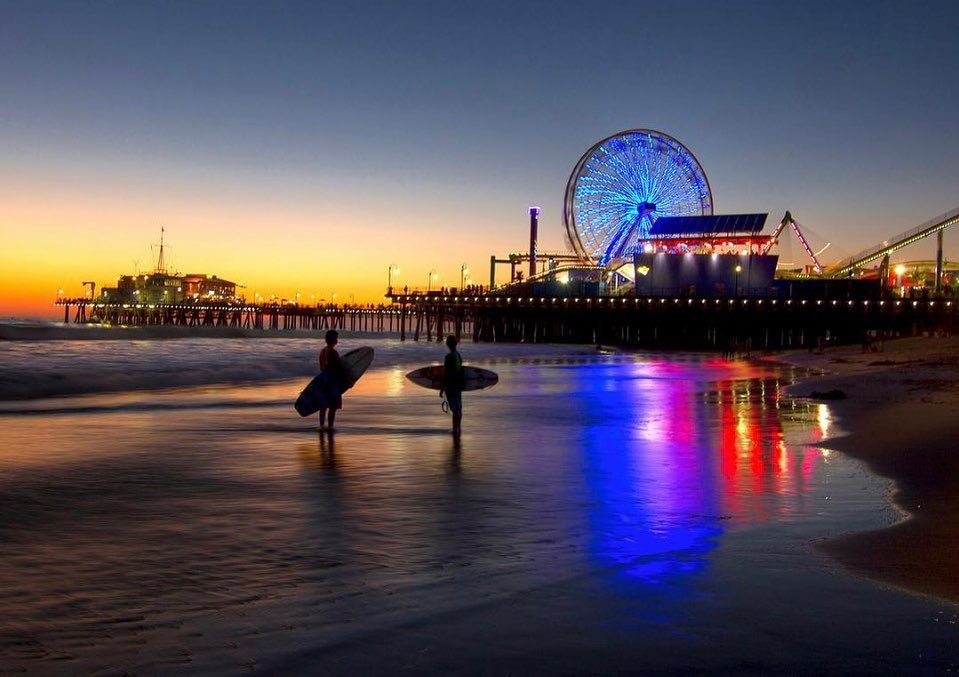 Surfers On The Beach