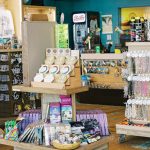 The inside of the Pier Gear souvenir shop filled with magnets, t-shirts, and gifts.